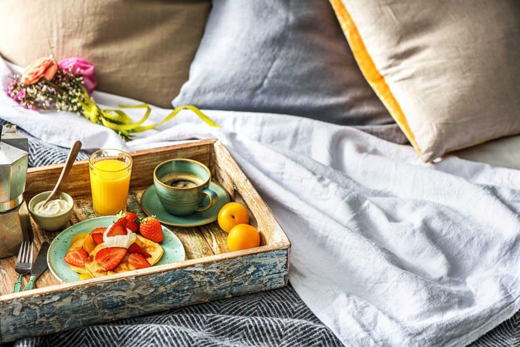 Mother's Day - breakfast in bed tray full of food and flowers